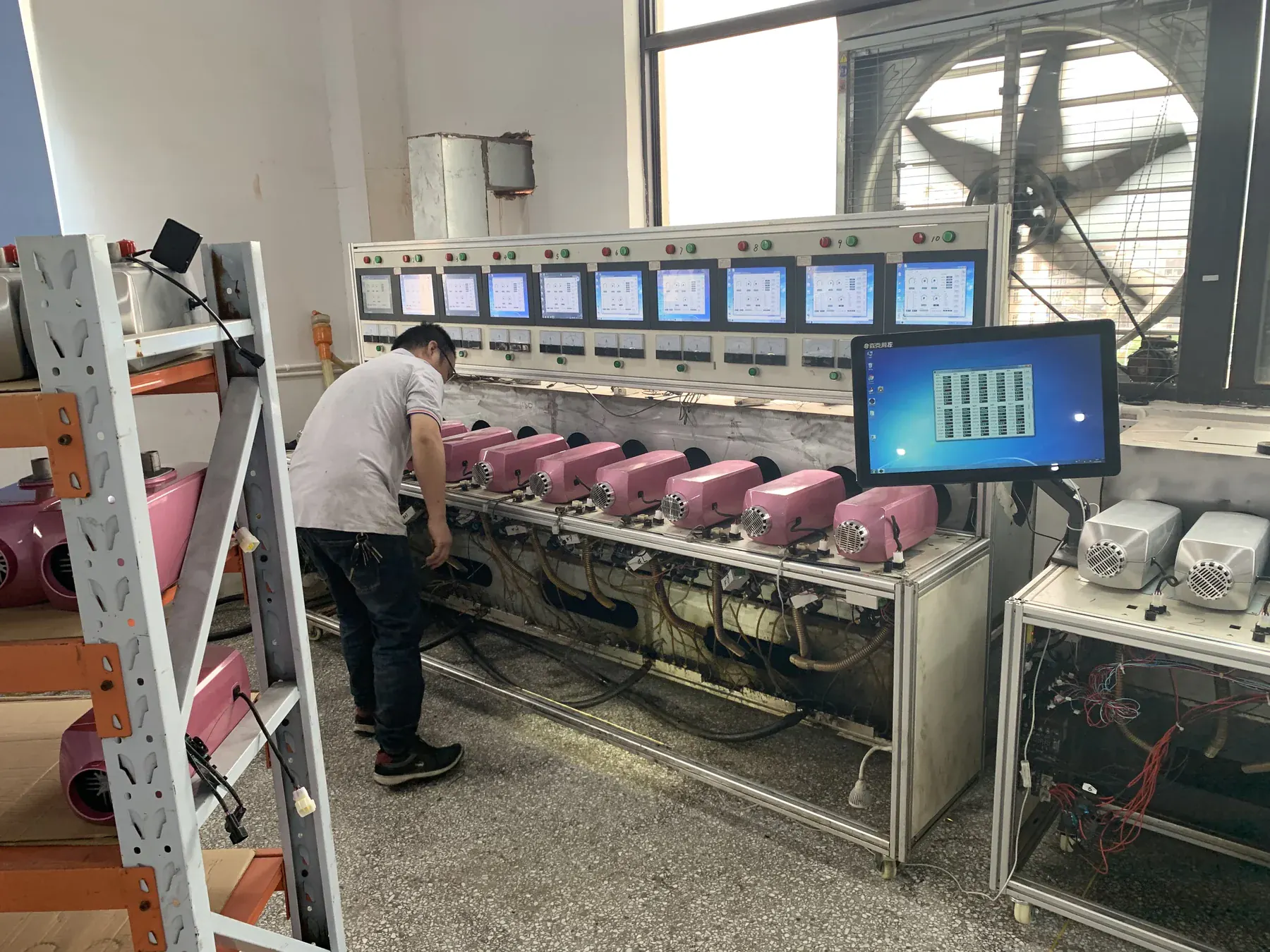 Parking heater units undergoing production-line testing